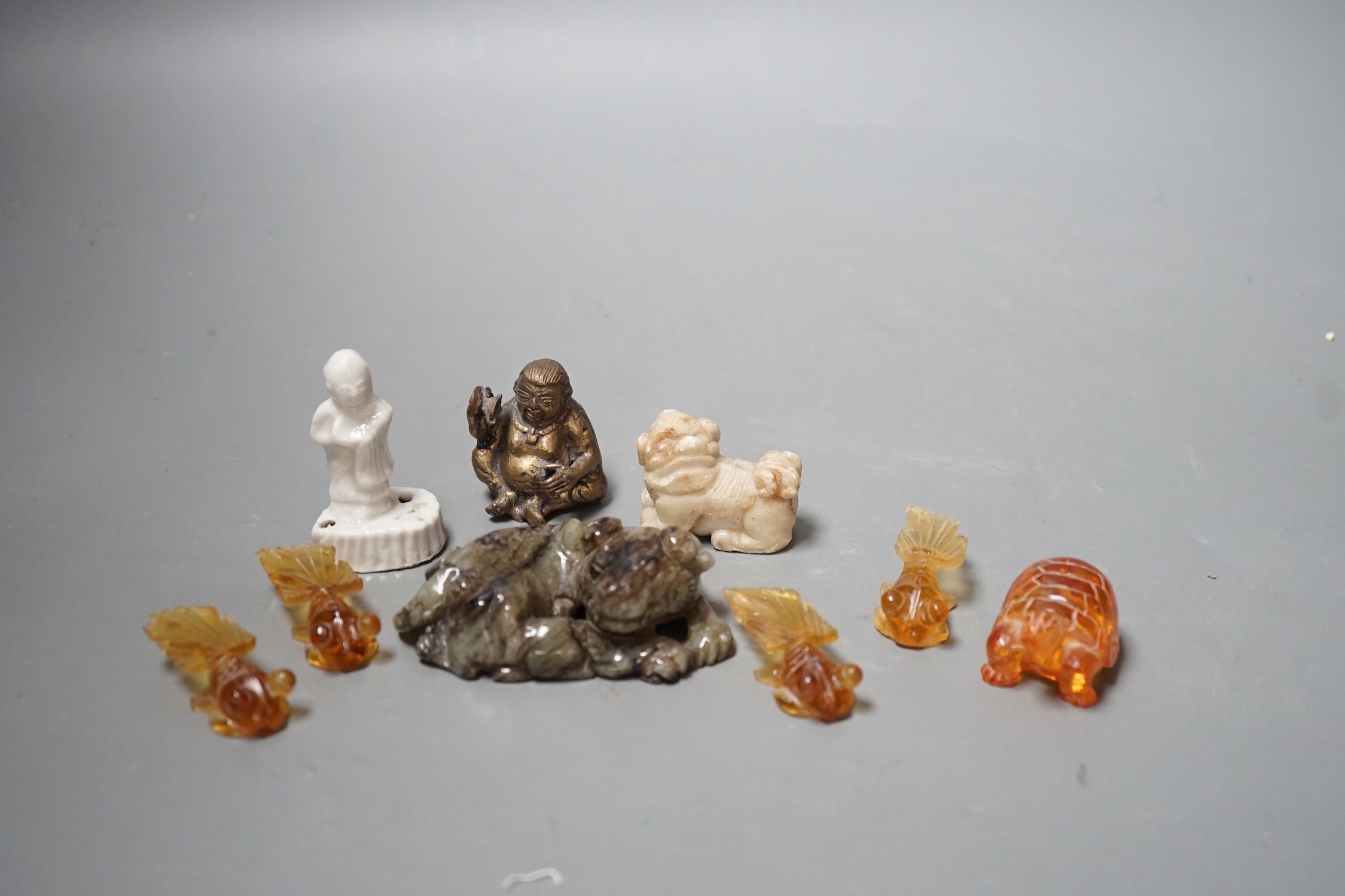 A group of Chinese jade, hardstone, faux amber carvings and models